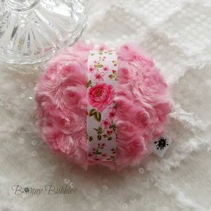 pink powder puff with roses