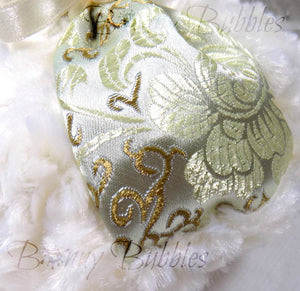 gold and ivory brocade puff