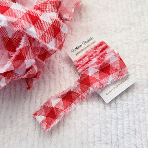 red torn fabric ribbon